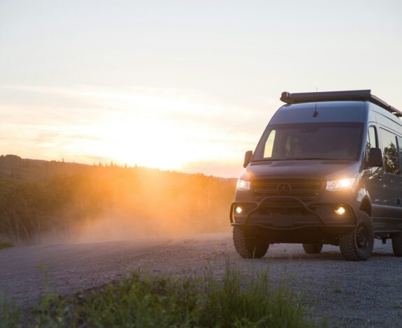 brown suv on dirt road during daytime